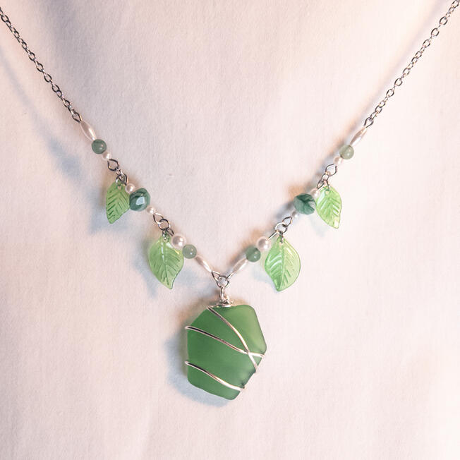green sea glass and leaves